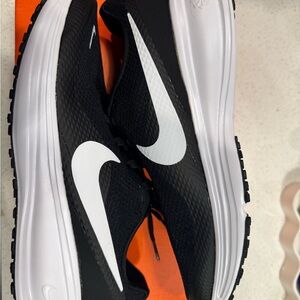 Nike Revolution 8 in Black, White, and Iron Grey
